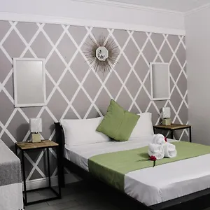 https://palm-spring-inn.comcaribbean.com